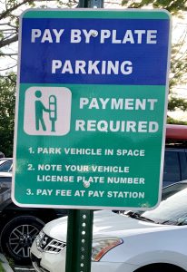 Pay by Plate Parking sign.